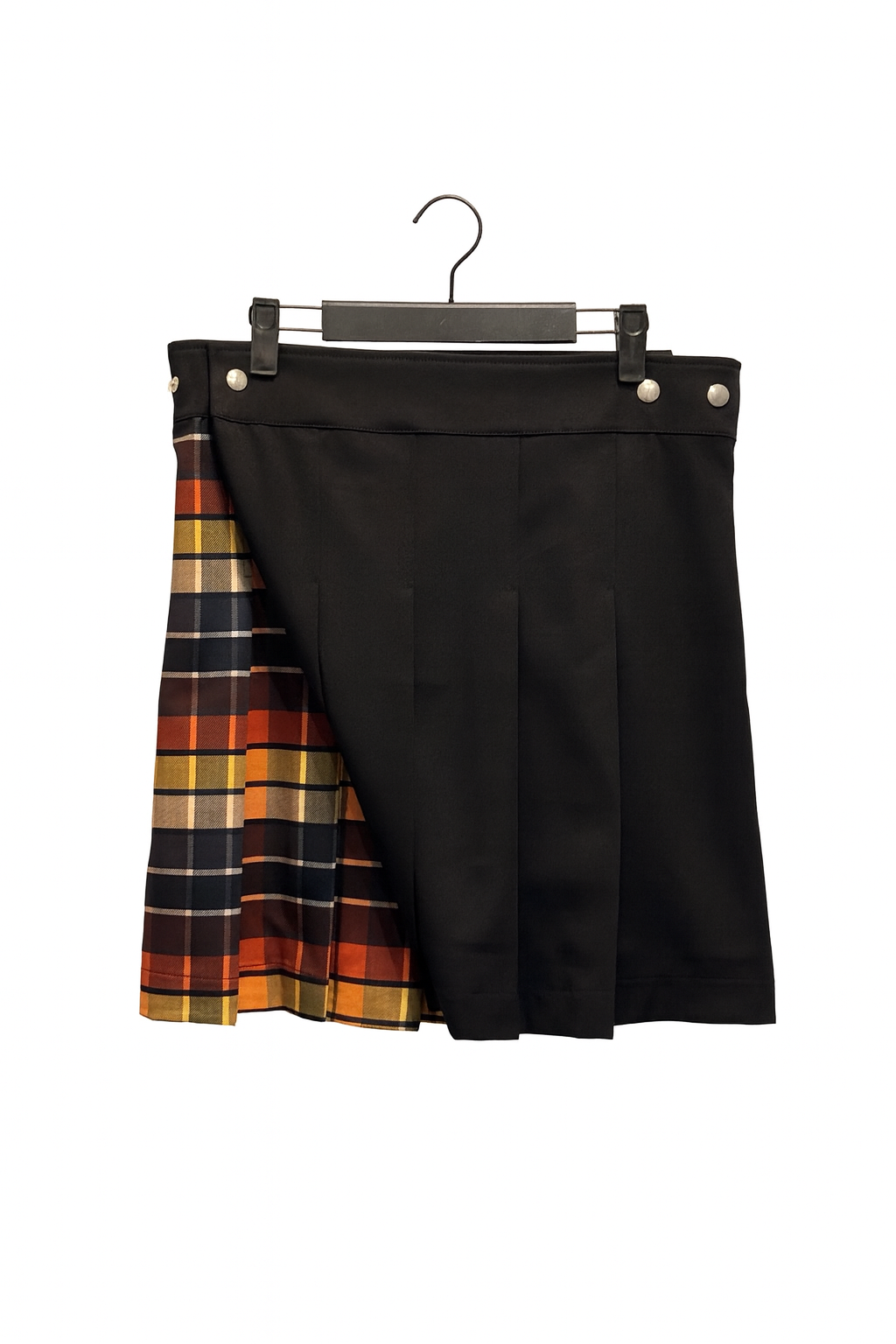 Black kilt with plaid pattern on a hanger against a white background
