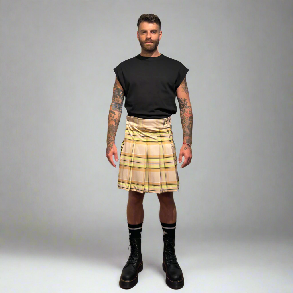 Man wearing a beige plaid kilt on a gray background