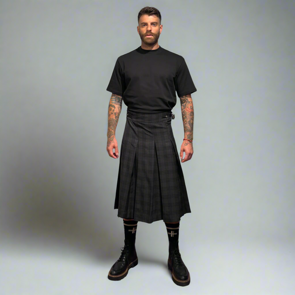 Man wearing a oxford kilt on a gray background