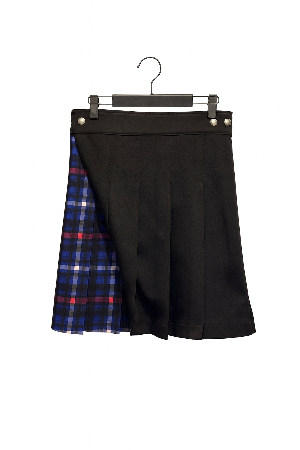 Black kilt with plaid pattern on a hanger against a white background