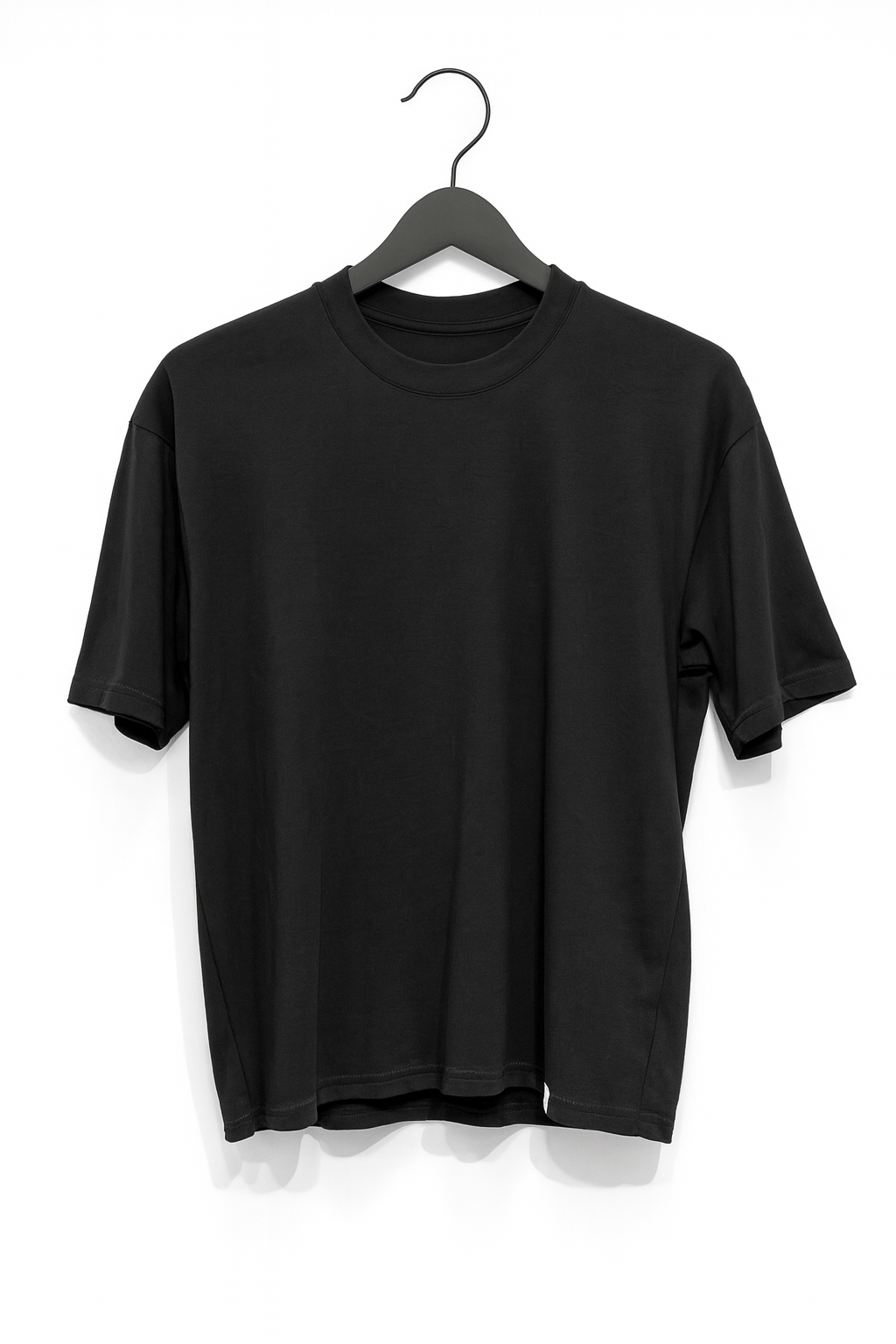 Black t-shirt on a hanger against a white background