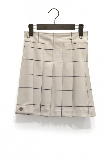White Plaid kilt on a hanger against a white background