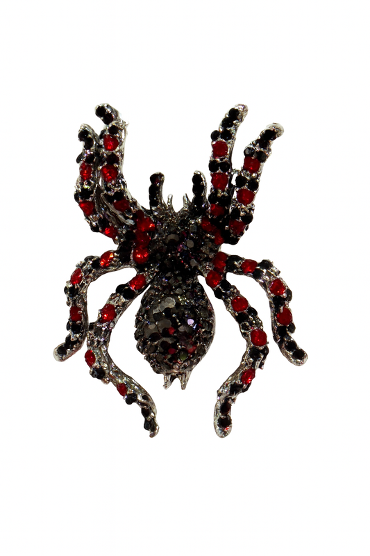Decorative spider with red gemstones on a white background