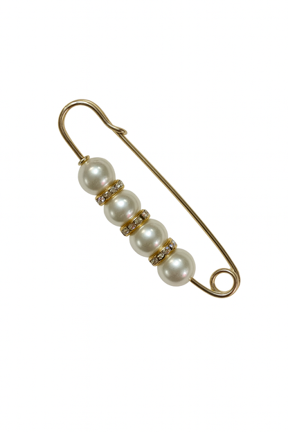 Gold safety pin with pearls on a white background