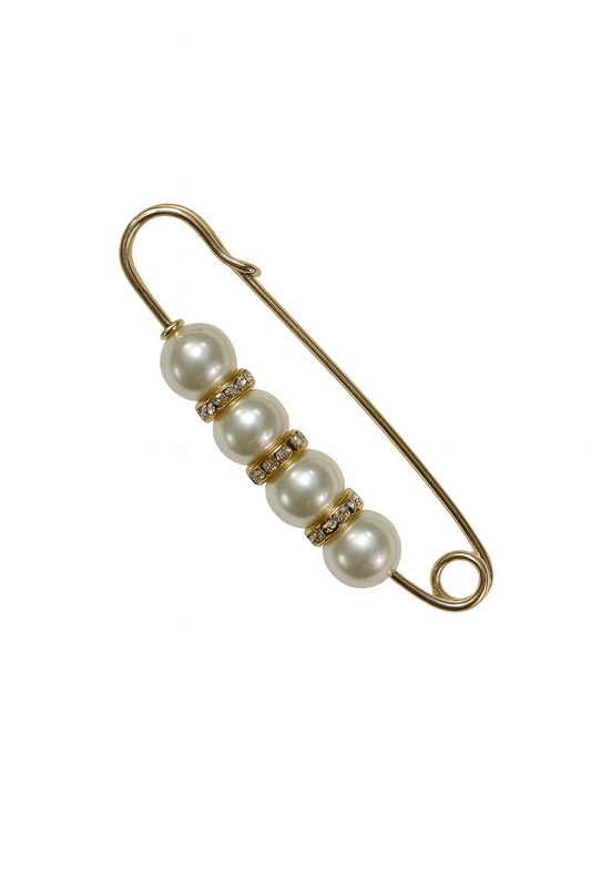 Gold safety pin with pearls on a white background