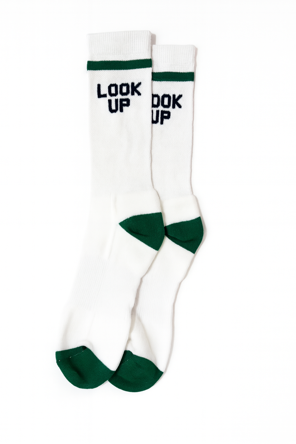 White socks with green accents and text 'LOOK UP' on a white background